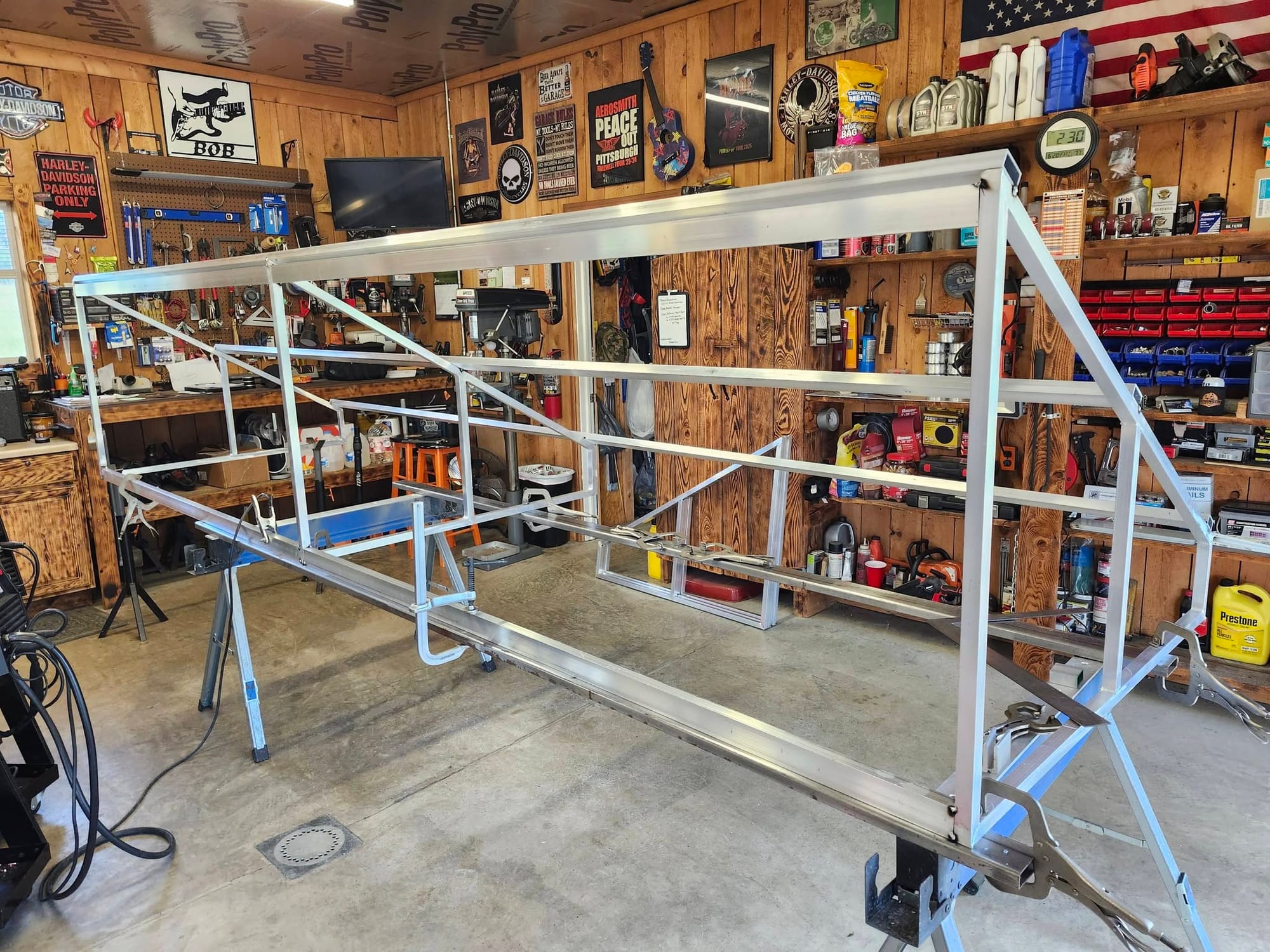 A large aluminum tube frame clamped up on stands in the middle of the Robinson Welding and Fabrication shop near Freeport, Pennsylvania
